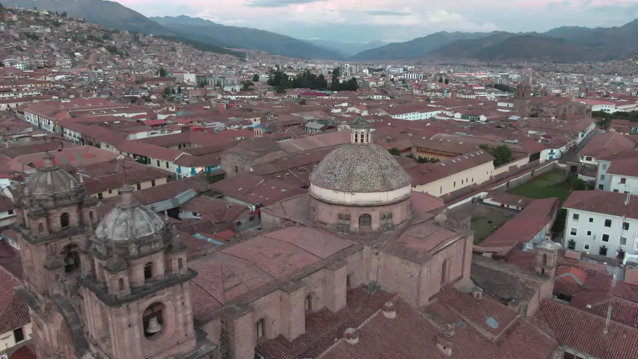 4k daytime aerial drone footage over the Church of the Society of Jesus from Plaza de Armas in Cusco Peru during Coronavirus lockdown