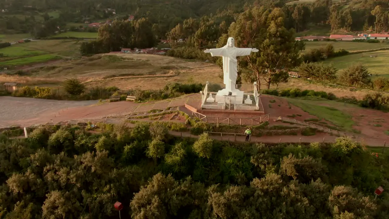 4K daytime before sunset aerial done view over the well known Cristo Blanco statue in the city of Cusco Peru