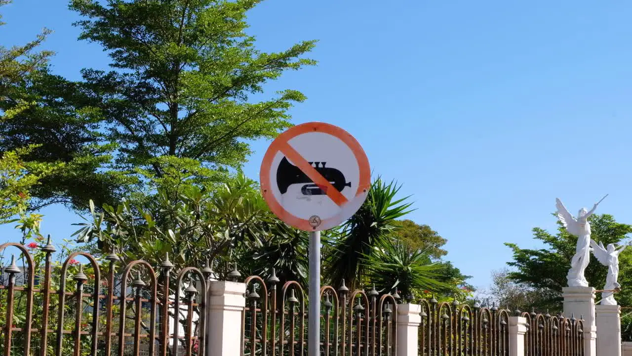 No music warning sign post for noise control outside a church in capital city Dili Timor-Leste Southeast Asia