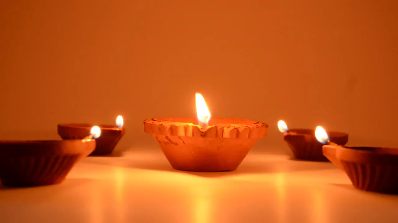 Diwali terracotta diyas on dark background which are used lighting up the house during Diwali times