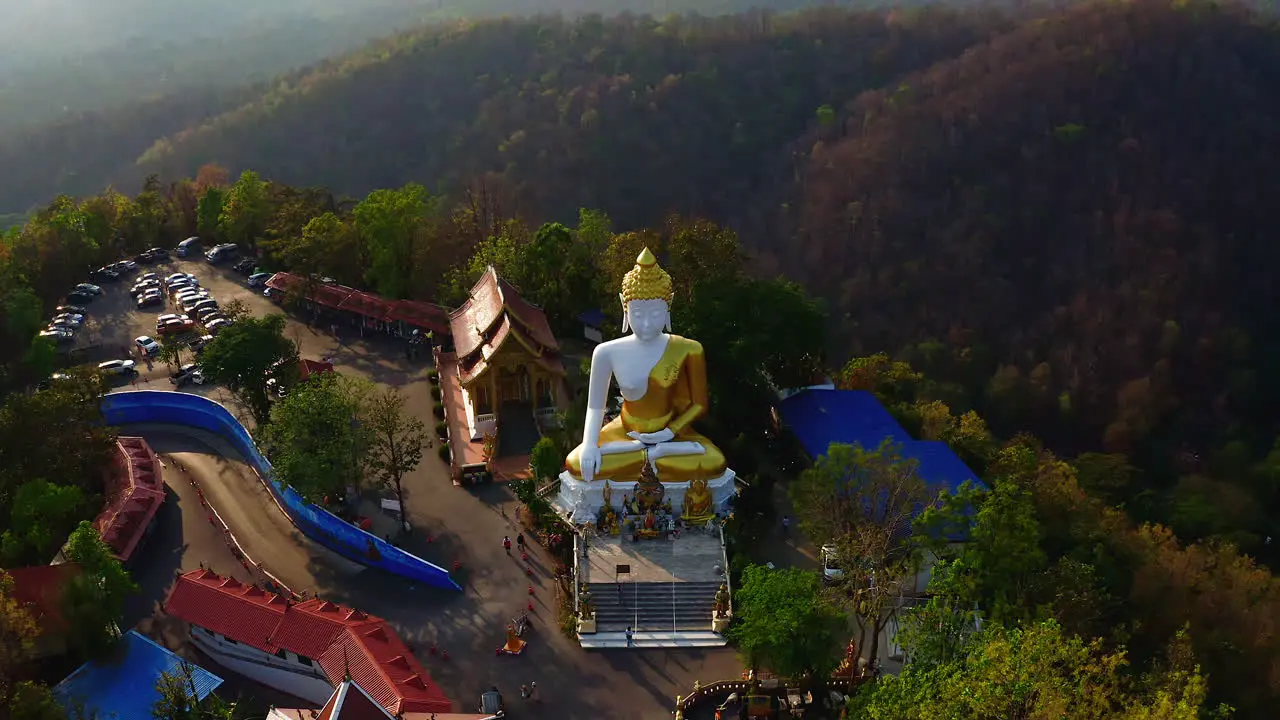 Golden statue of sitting Buddha in Wat Phra That Doi Kham temple