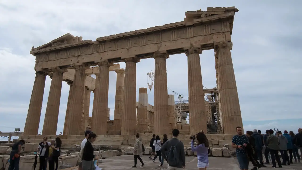 Parthenon temple with tourist around on the Acropolis in Athens Greece on 10-15-2021