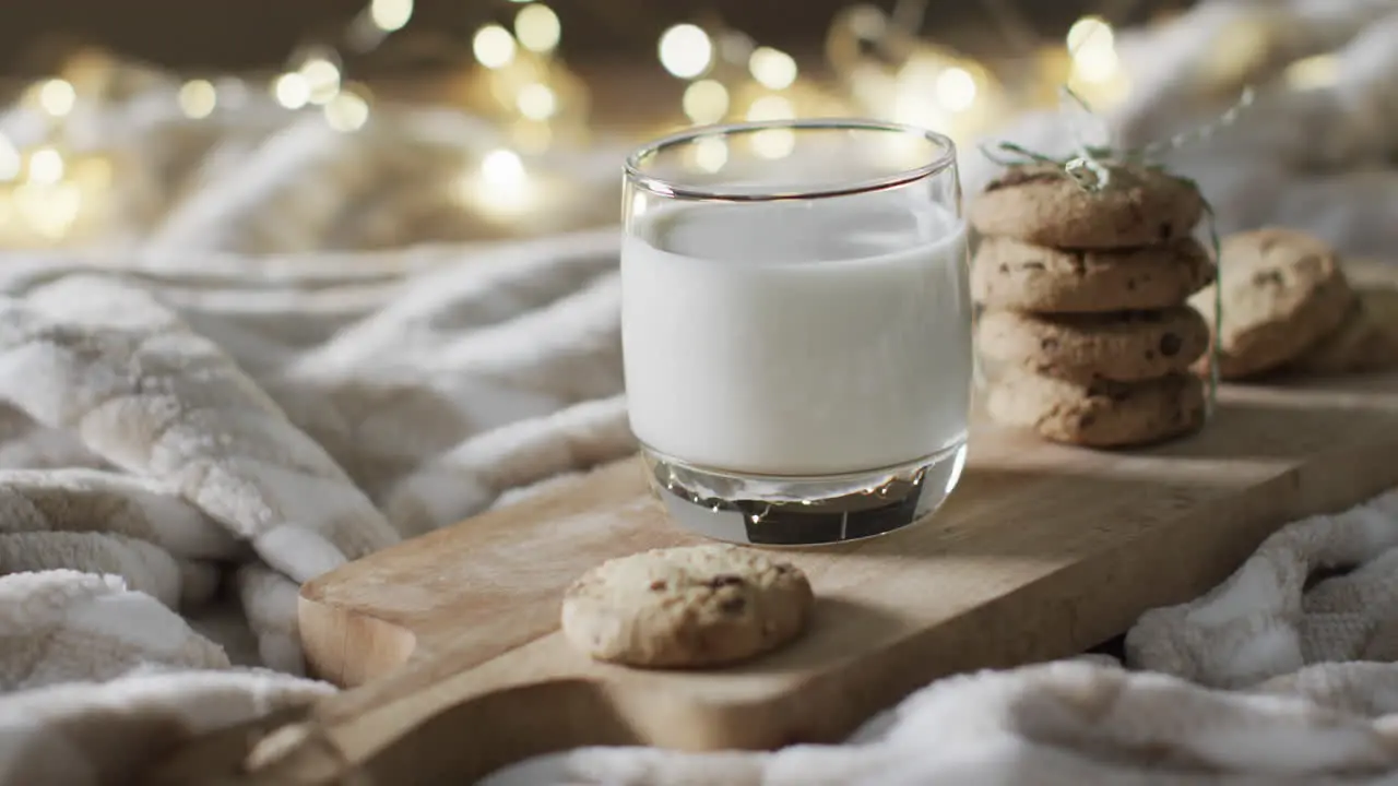 Video of christma cookies glass of miljk and copy space on white background