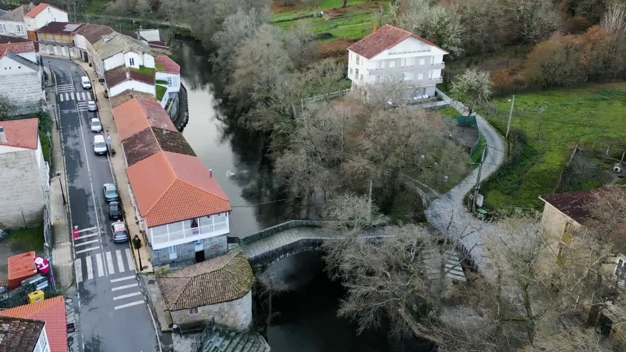 Panoramic aerial overview of historical roman bridge crossing river molgas