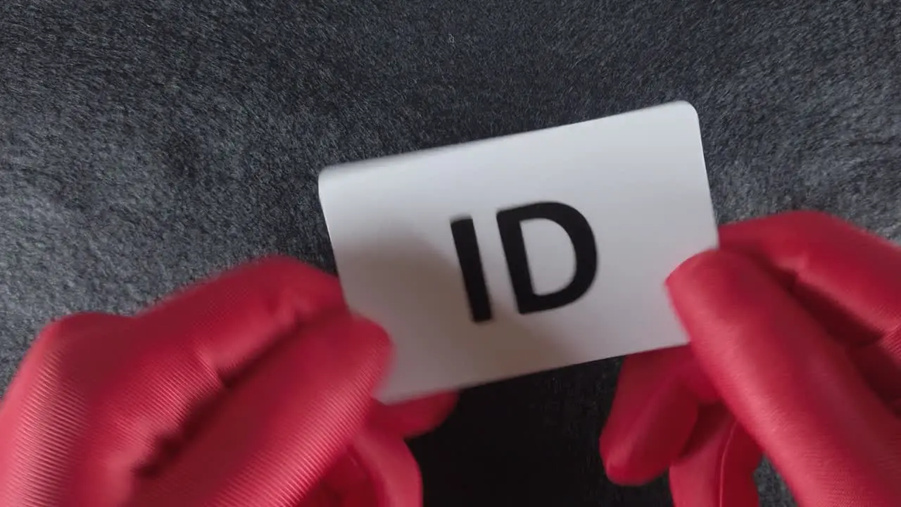 An 'ID' identification card being presented or checked to gain entry or to prove someone's identity