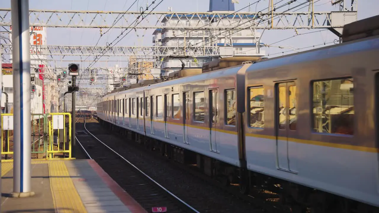 Train Arriving at Tsuruhashi Station in Japan Sunny Warm Day in Osaka