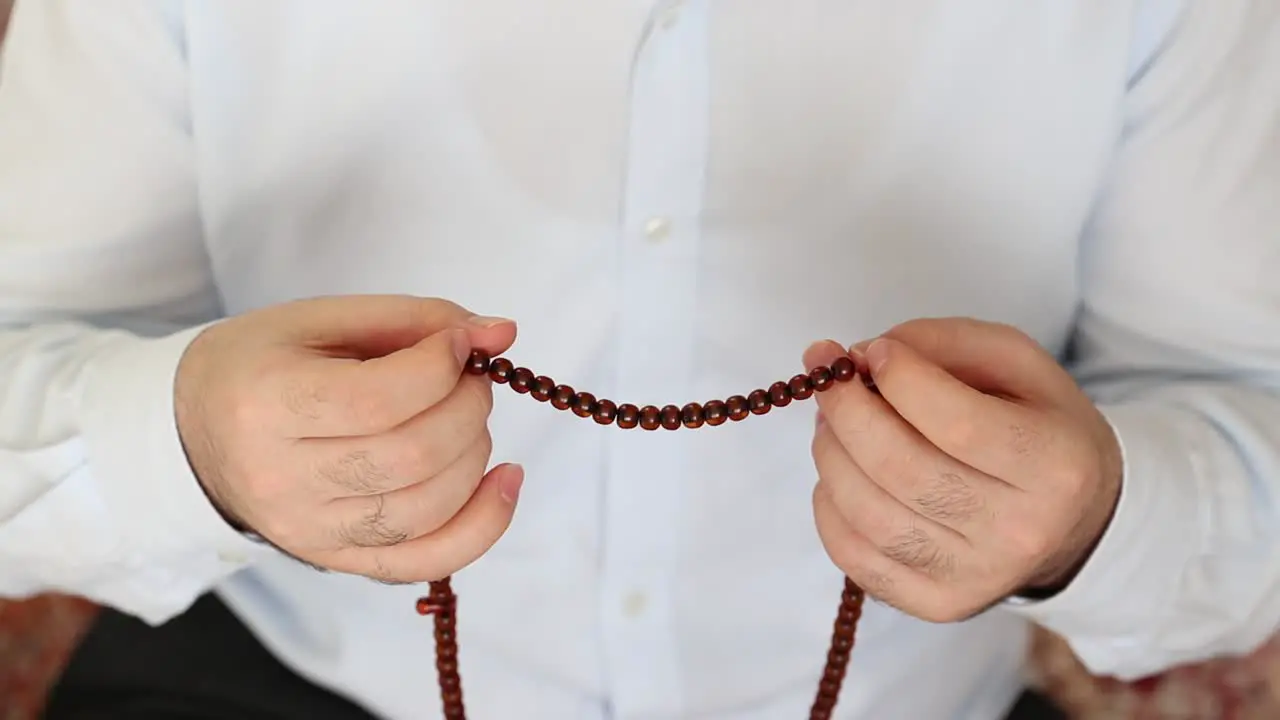 Muslim Praying With Bead For Allah