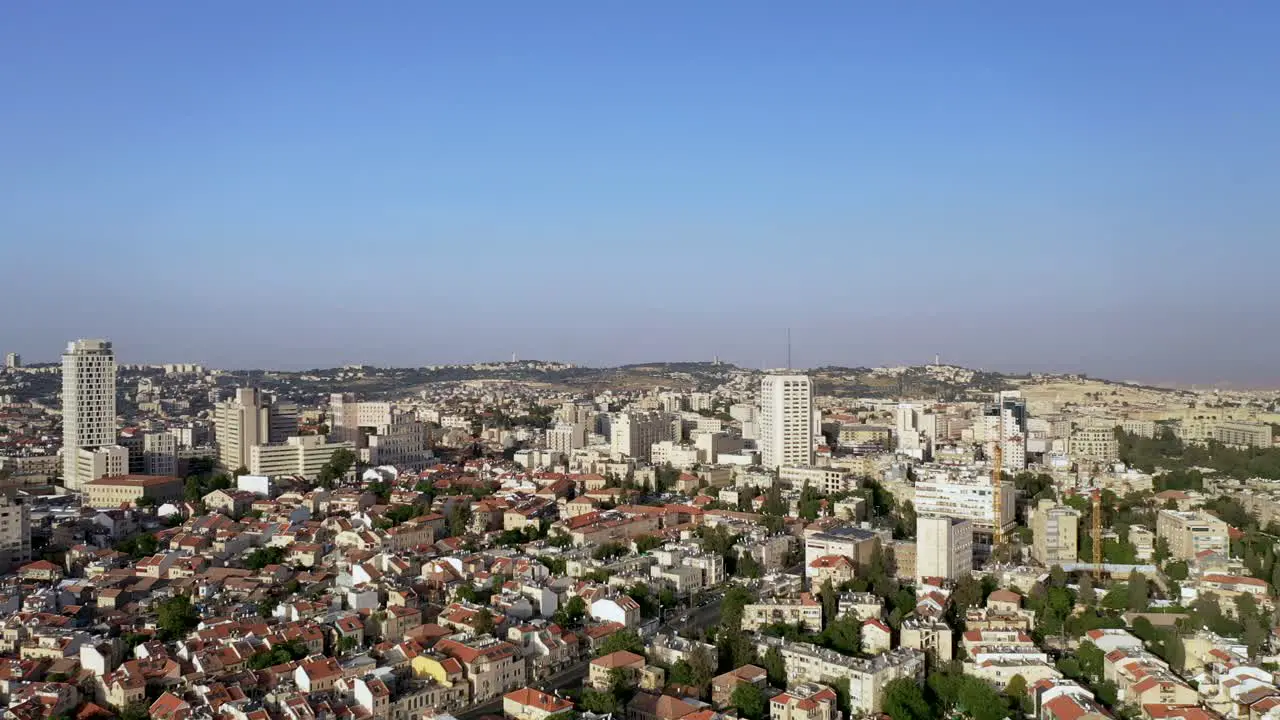 Warm saturated Aerial high view of Jerusalem urban city center Panorama rotating shot