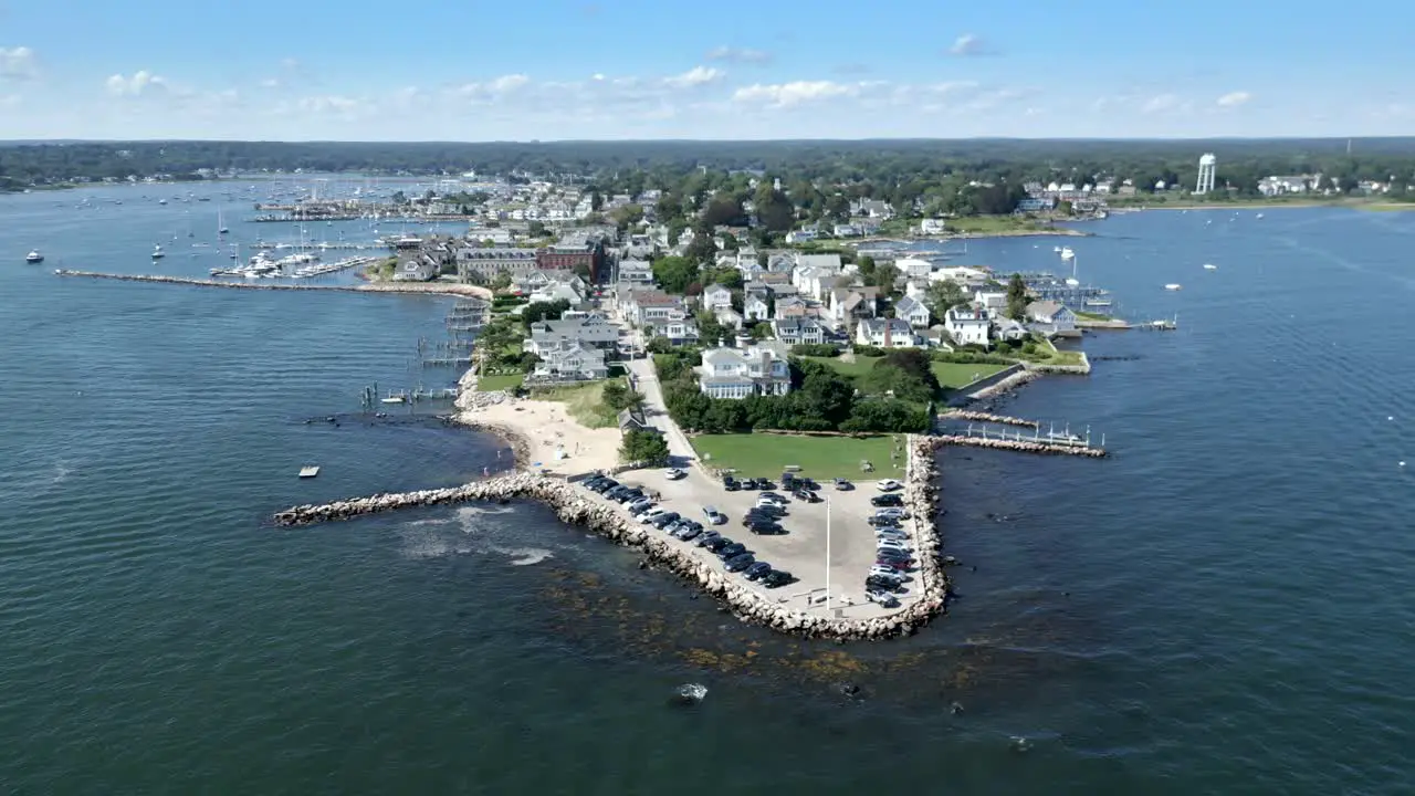 Pan left across Dubois Point Stonington Connecticut on sunny day iconic victorian era sea houses with docks