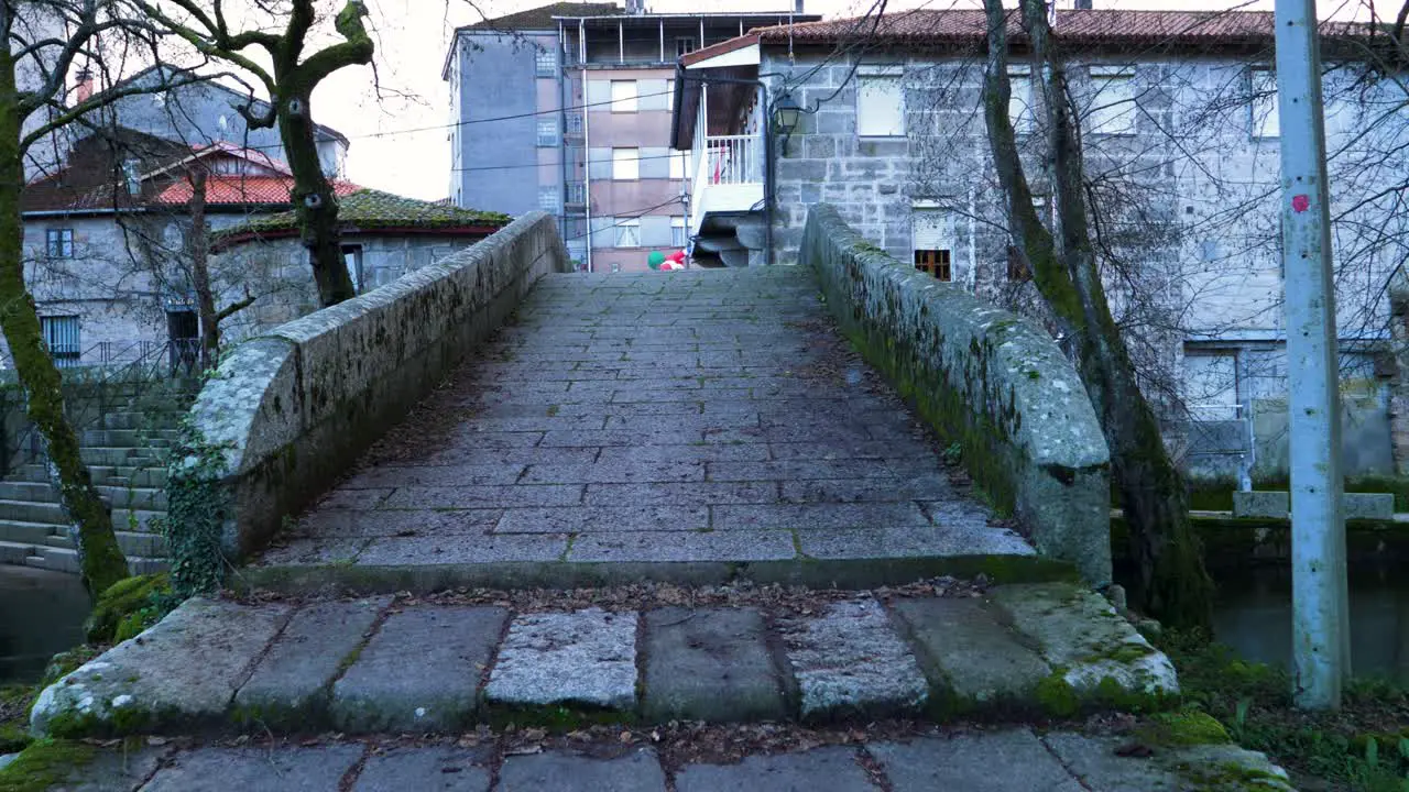 Weathered stone steps of granite up to river Molgas Roman bridge