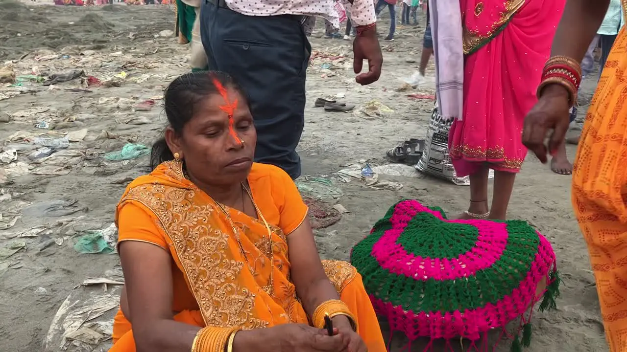 Devotees practicing rituals during Chhat Puja festival at Yamuna river in New Delhi