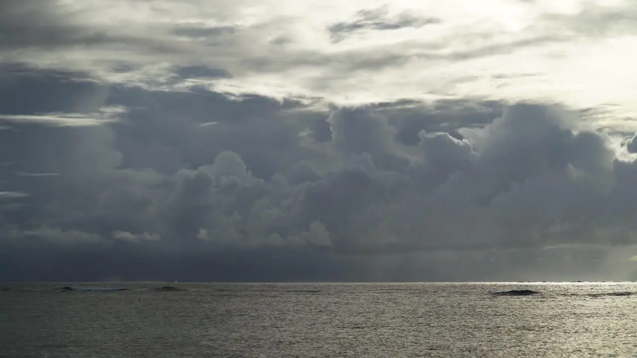 Peaceful ocean waves with breathtaking clouds in background during a sunny day