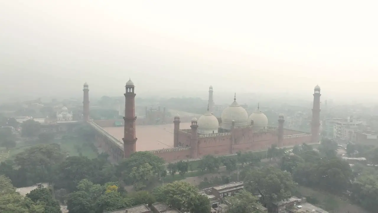 Aerial View Of Iconic Badshahi Mosque In Lahore Pakistan Through Hazy Air