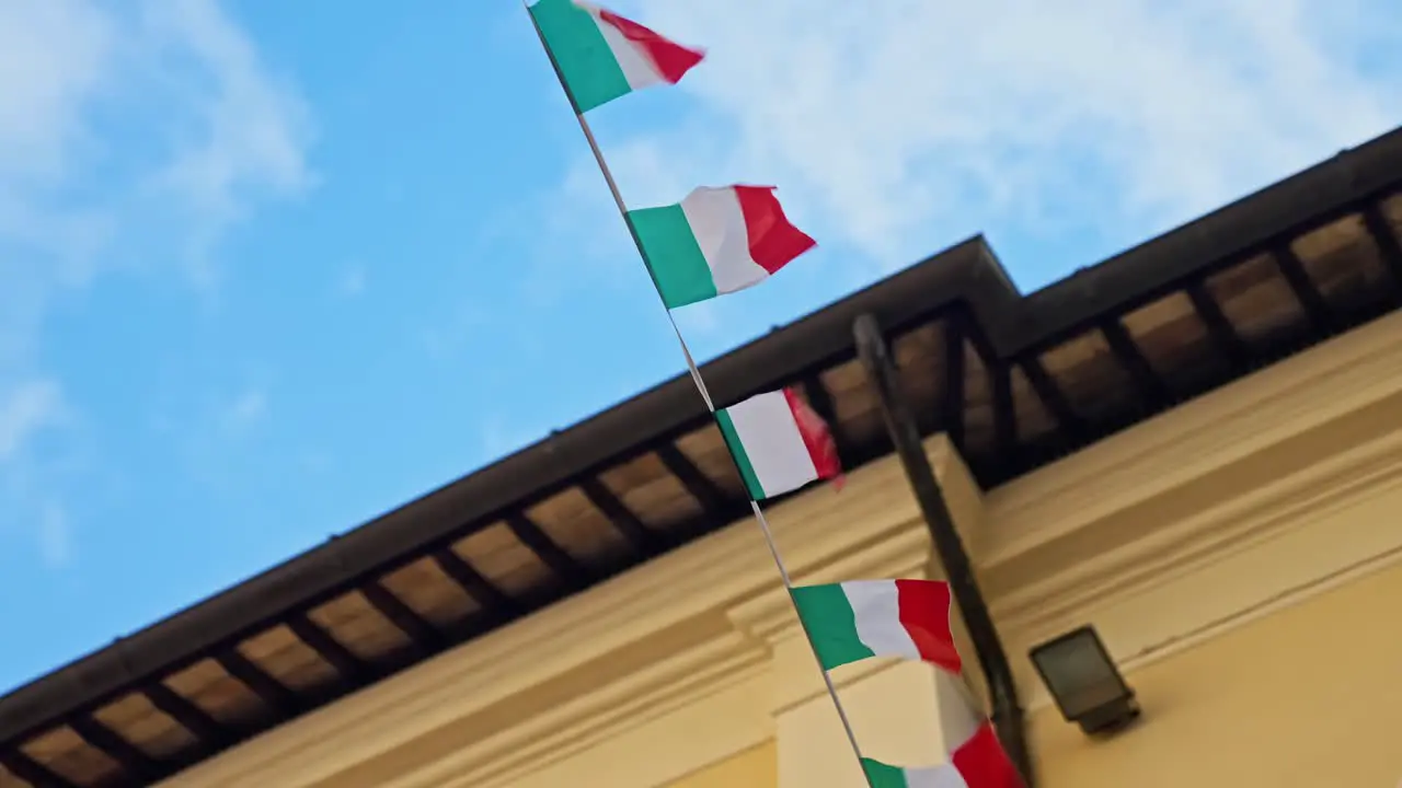 Italian Flags Fluttering Above The Street In The Town Of Assisi In Umbria Italy