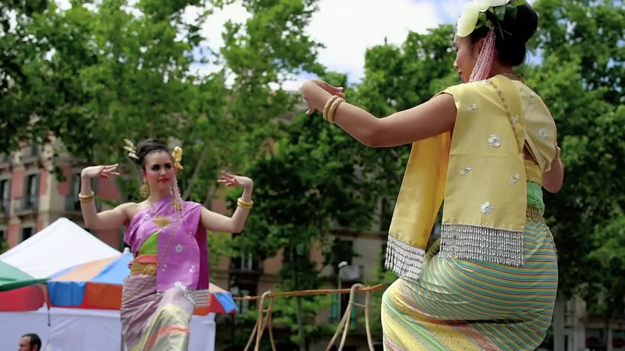 Two thai girls dancing in a perfomance in Barcelona