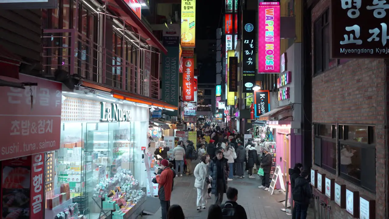 Seoul crowds pedestrianised shopping streets at Myeongdong city nightlife in South Korea