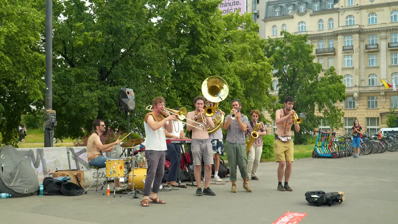 Street performance by the popular music group Retropico in the center of Warsaw at the Wisława Szymborska Passage