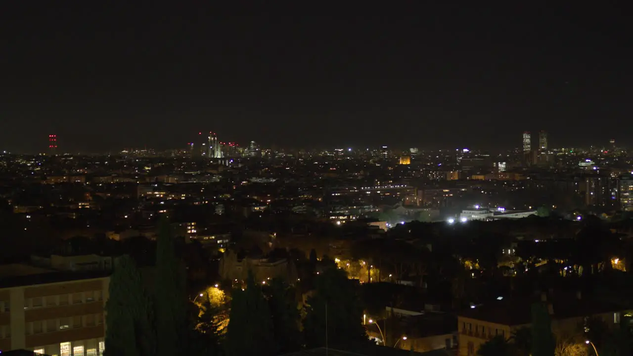 4K Wide panorama of Barcelona with the Sagrada Família in the skyline at night