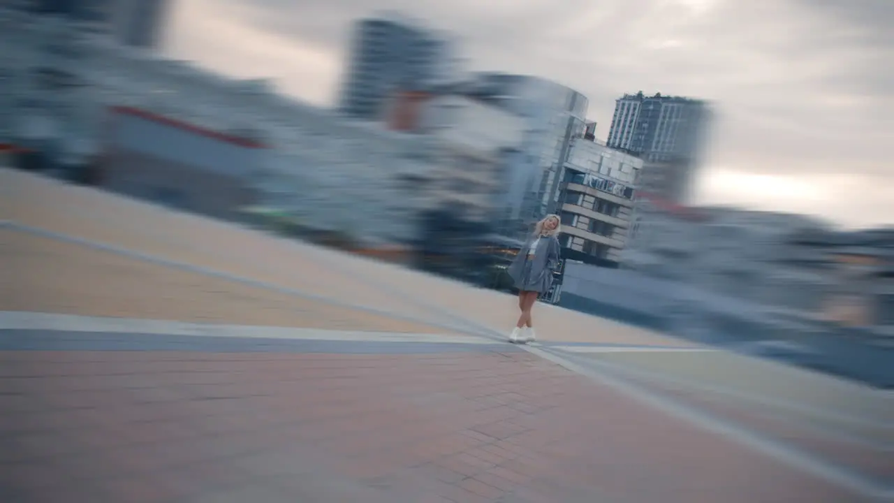 Woman standing alone city in downtown at sunset street lights