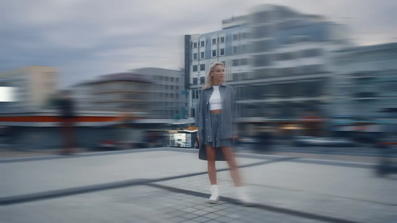 Alone woman standing city at evening in modern building area