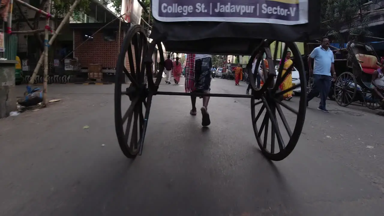 Stock footage of Kolkata street road and working people and hand rickshaw