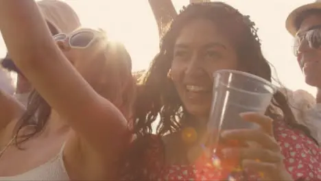 Close Up Shot of Young Festival Goers at Festival Barrier Enjoying Music After Taking Selfie