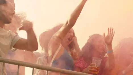 Low Angle Shot of a Group of Festival Goers at Stage Barrier Enjoying the Music