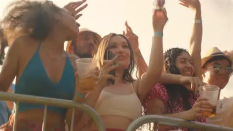 Low Angle Shot of Festival Goers at Stage Barrier the Enjoying Music