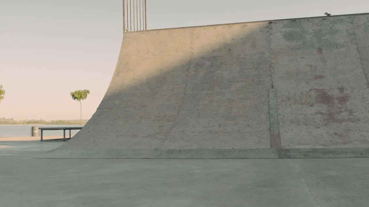 Young Skater Girl Doing Tricks On A Ramp In A Skate Park 1