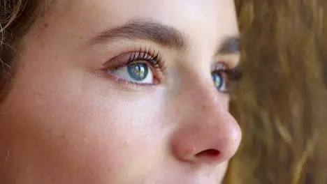 Closeup of a woman staring with hope for humanity