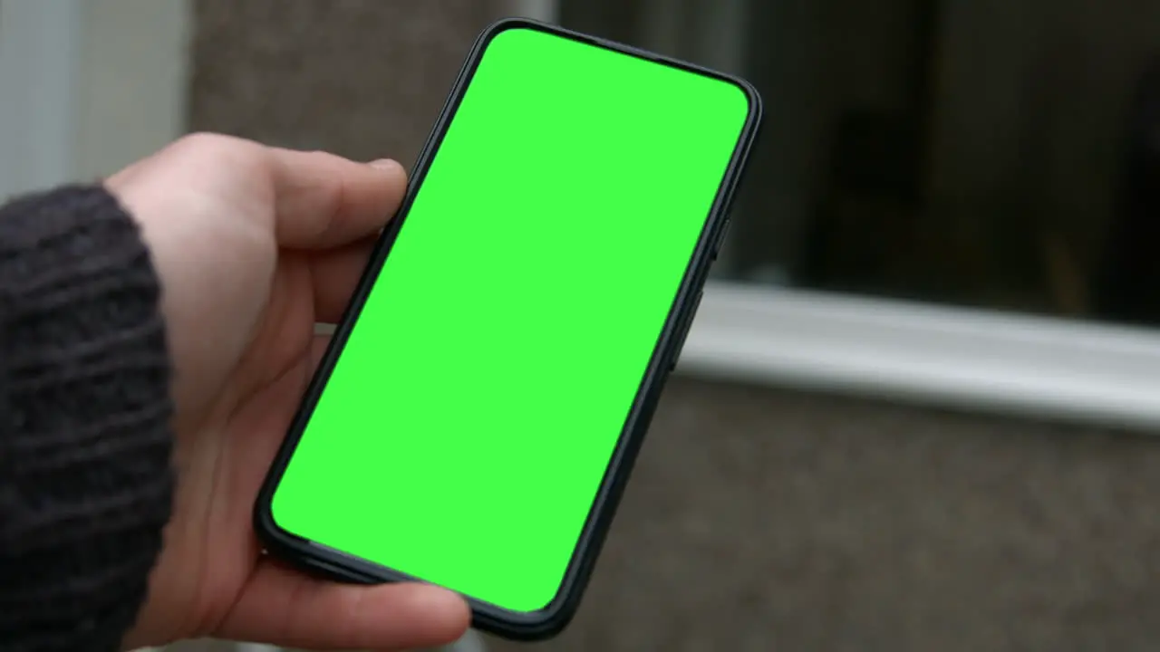 Male Hand Holding Smart Phone Green Screen Replacement 4K