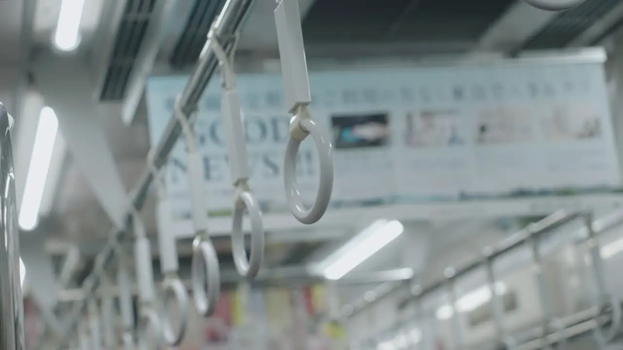 White Handrails On A Train In Tokyo Japan