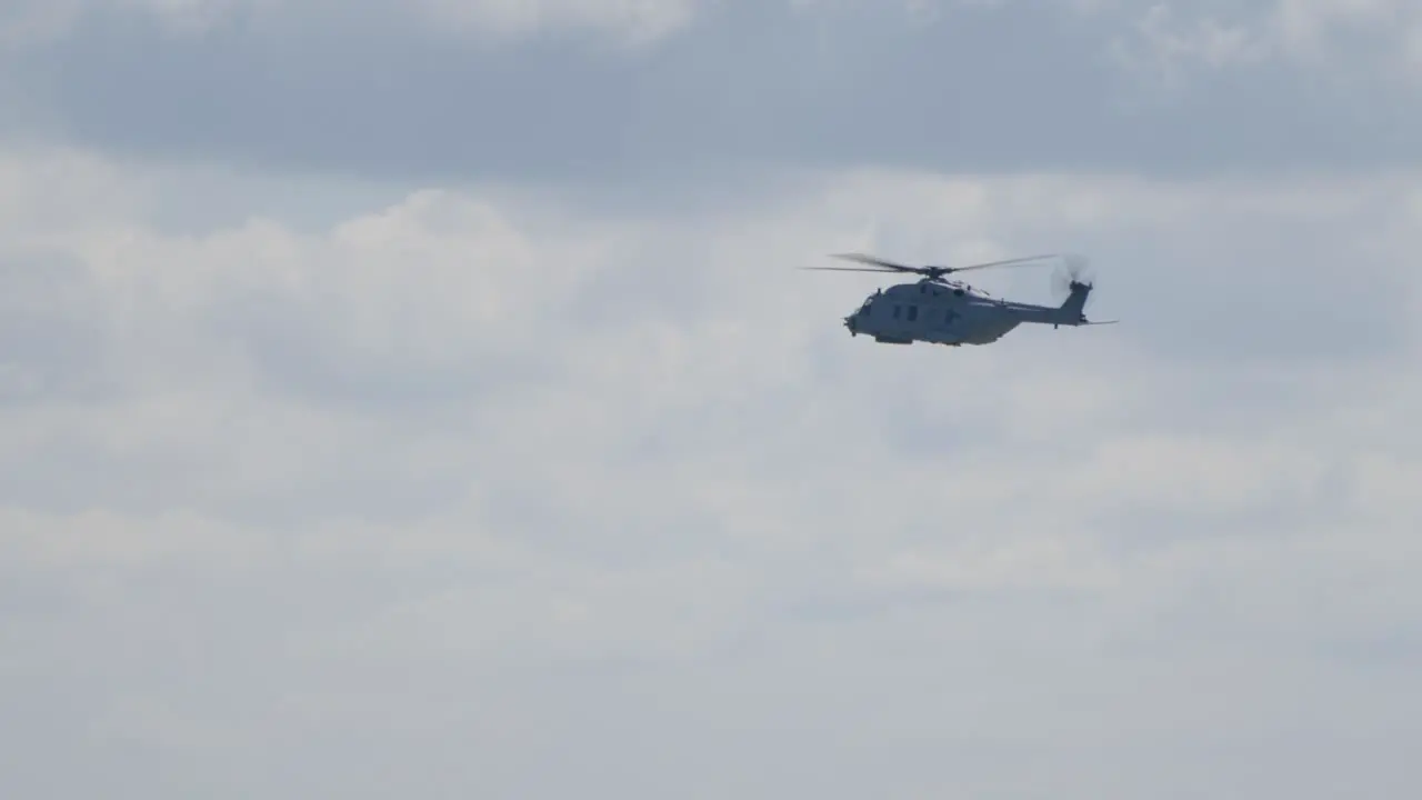 NH90 Military Helicopter Flying Against Cloudy Sky Backdrop TRACKING