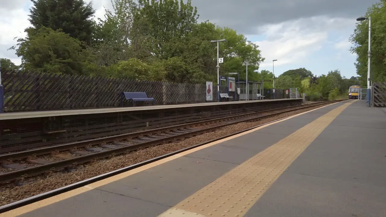 Static Shot of Northern Train Arriving at Rural Station in North Yorkshire on a Summer’s Day