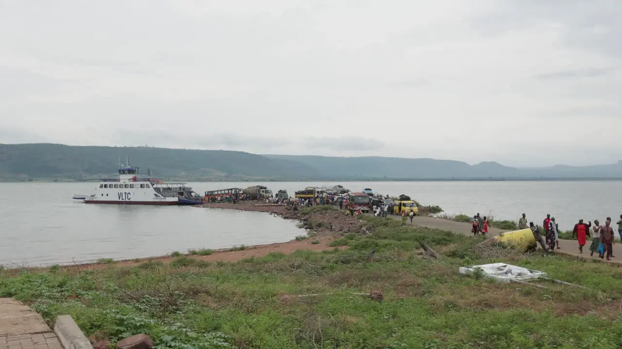 Passengers and Vehicles Disembarking Cargo Vessel to an Island in Ghana