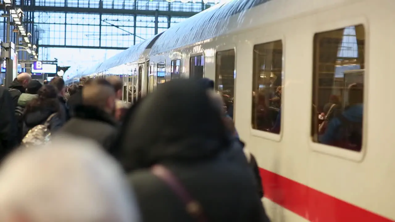 Crowded platform with many people waiting for entering train in Frankfurt