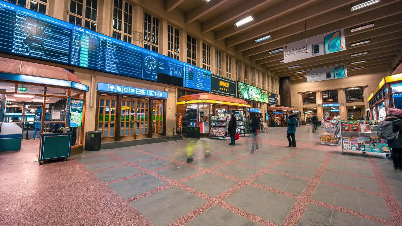 Timelapse of people walking inside the Helsinki railway station Static time lapse view