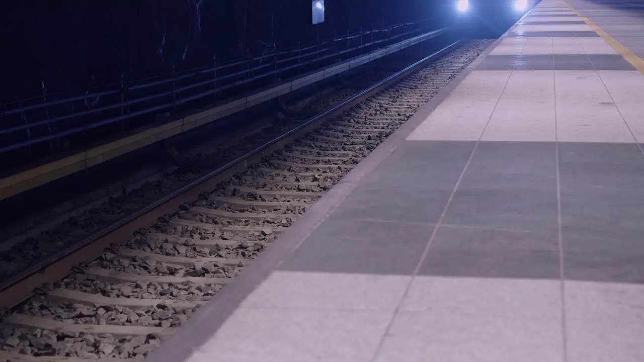 Low angle Helsinki public transit train arrives in underground subway