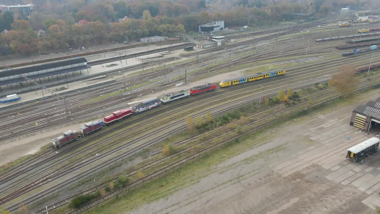 Aerial of parked locomotives and train on abandoned train yard