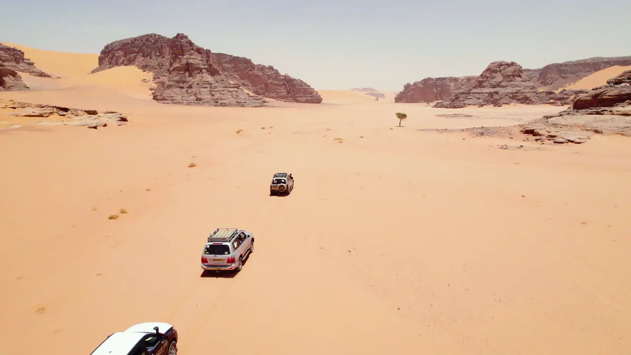 Aerial View Of Caravans Traveling Across Sahara Deserts Near Djanet In Southeast Algeria