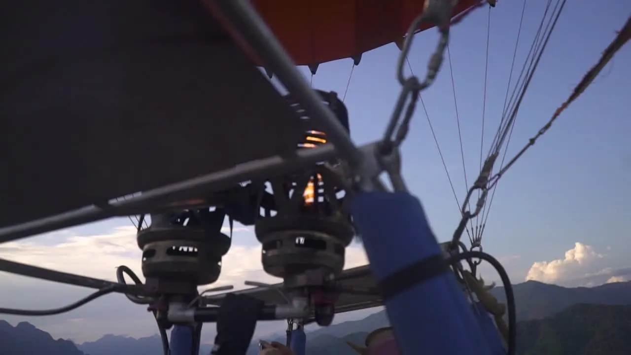 the fire burning Inside a hot air balloon as the driver ignite more fuel to higher the position of the balloon