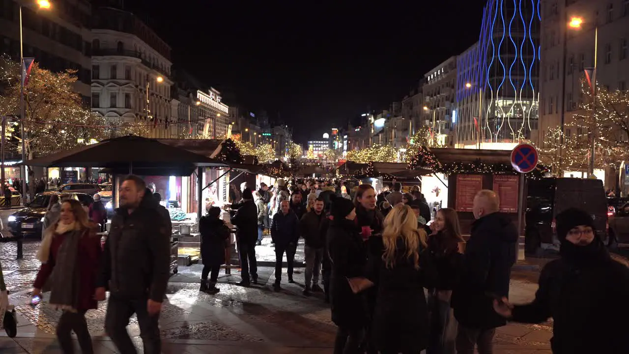 People enjoying Christmas markets at Wenceslas square at night Prague