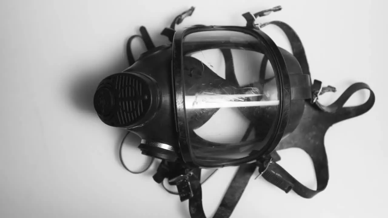 Gas Mask on White Surface Static Shot 01