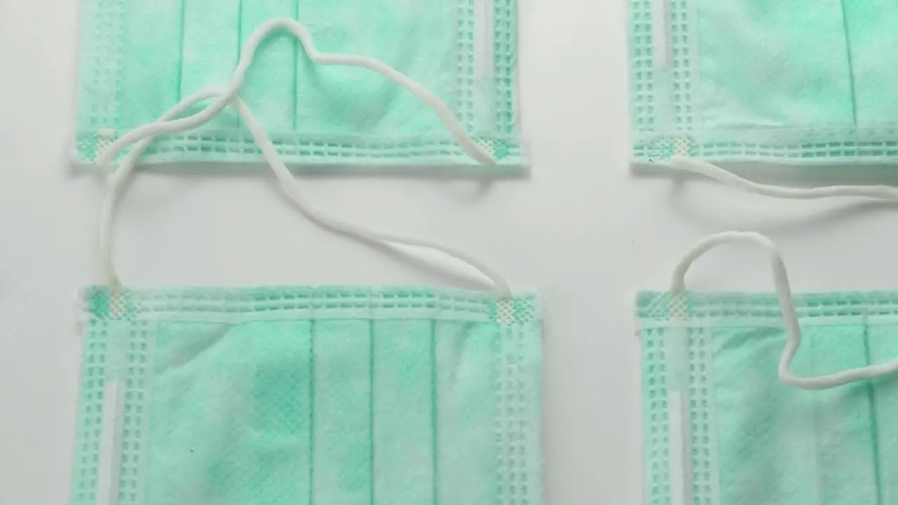 Face surgical Masks side by side displayed in pattern Overhead slide extreme close up