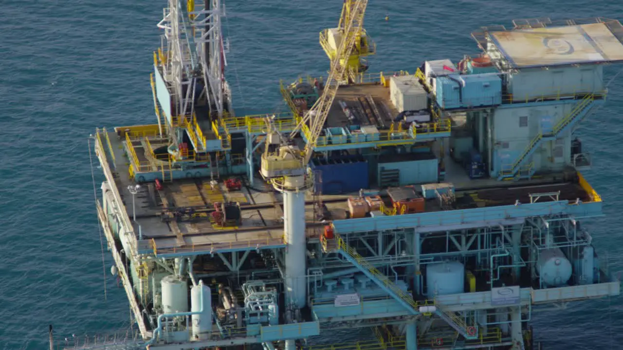 An aerial shot over oil derricks and platforms in the Santa Barbara Channel California