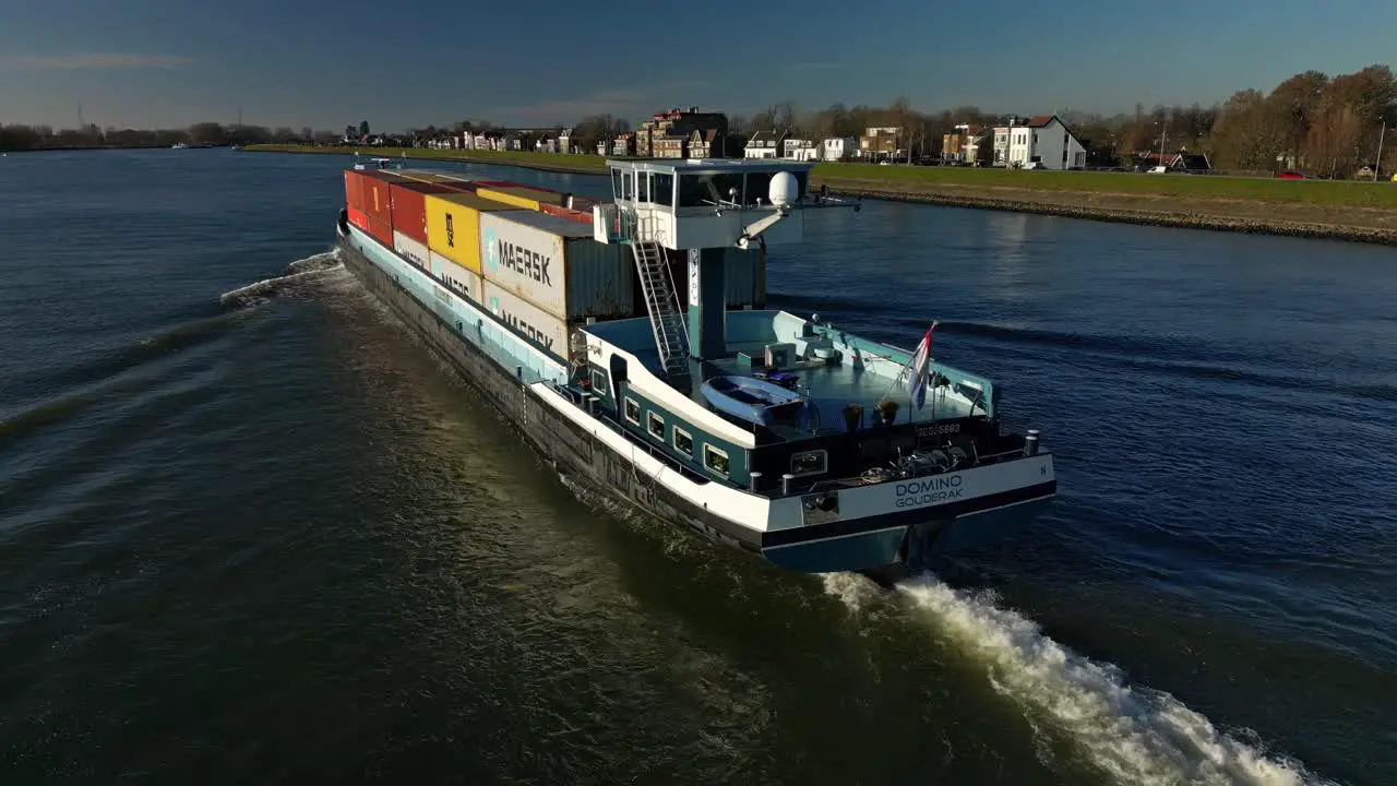 Cargo Inland Ship Transporting Containers Across The River In Netherlands