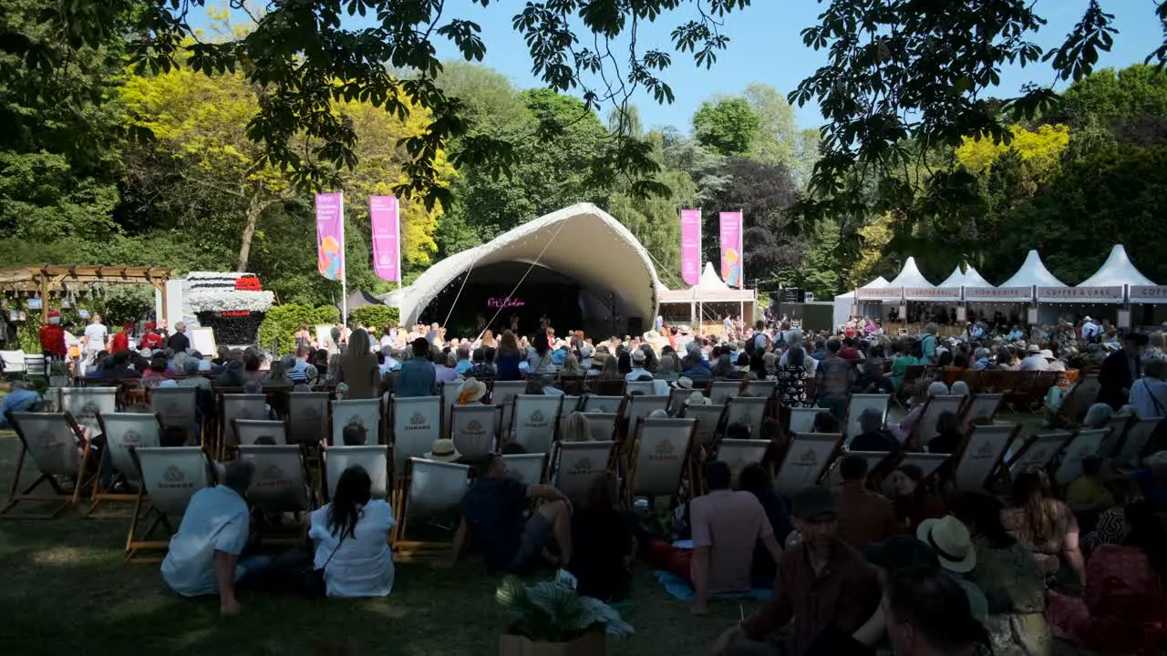 People enjoying a concert at the chelsea flower show festival