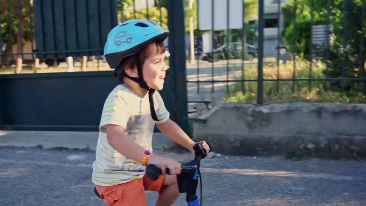 A kid rides a bicycle SLOWMOTION