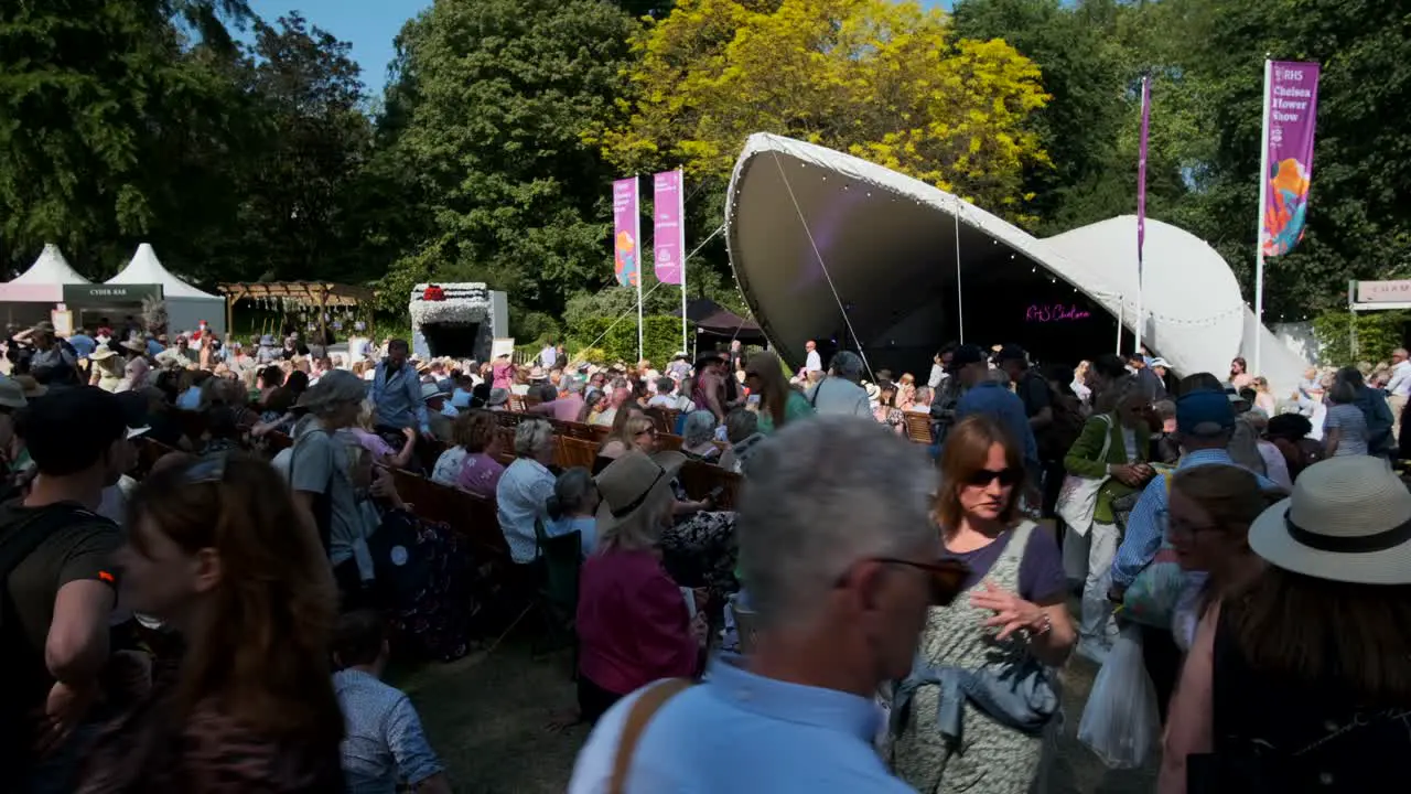 Looking towards the concert stage at a crowded chelsea flower show