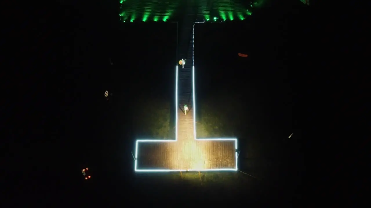 Aerial shot of dancer dancing in the music festival of Mexico during the night time